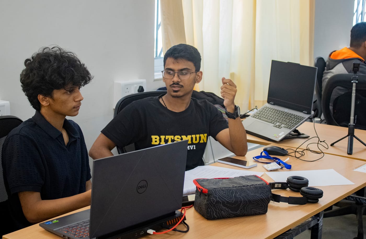 Jared Furtado pair programming with a teammate at a hackathon