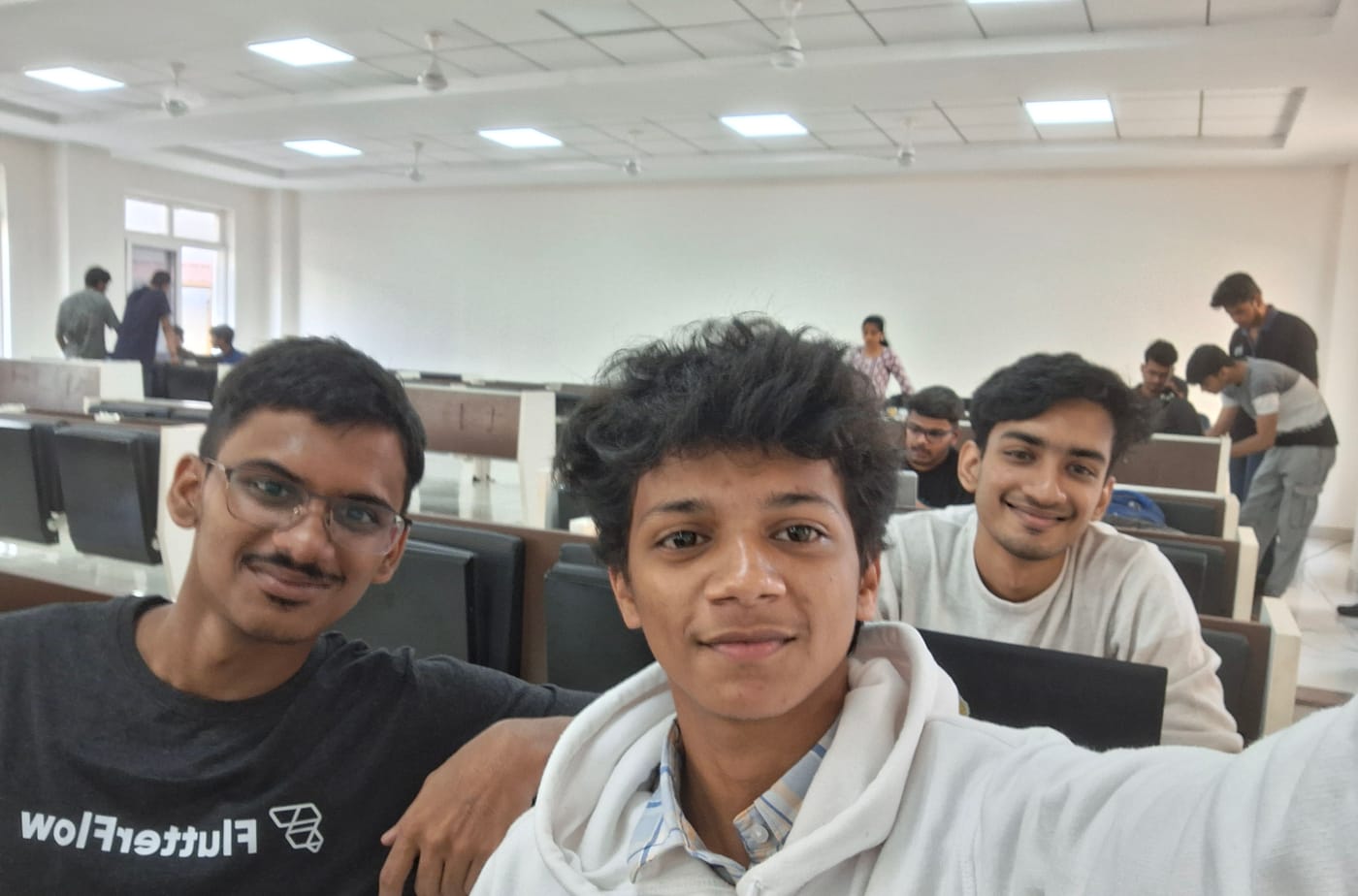 Selfie of Jared Furtado with fellow participants in a hackathon hall
